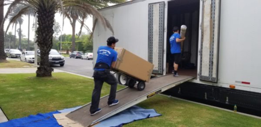 Moving Pro Inc movers loading a truck